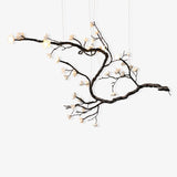 Lustre branche d’arbre en laiton noirci et fleurs en céramique — Grémil