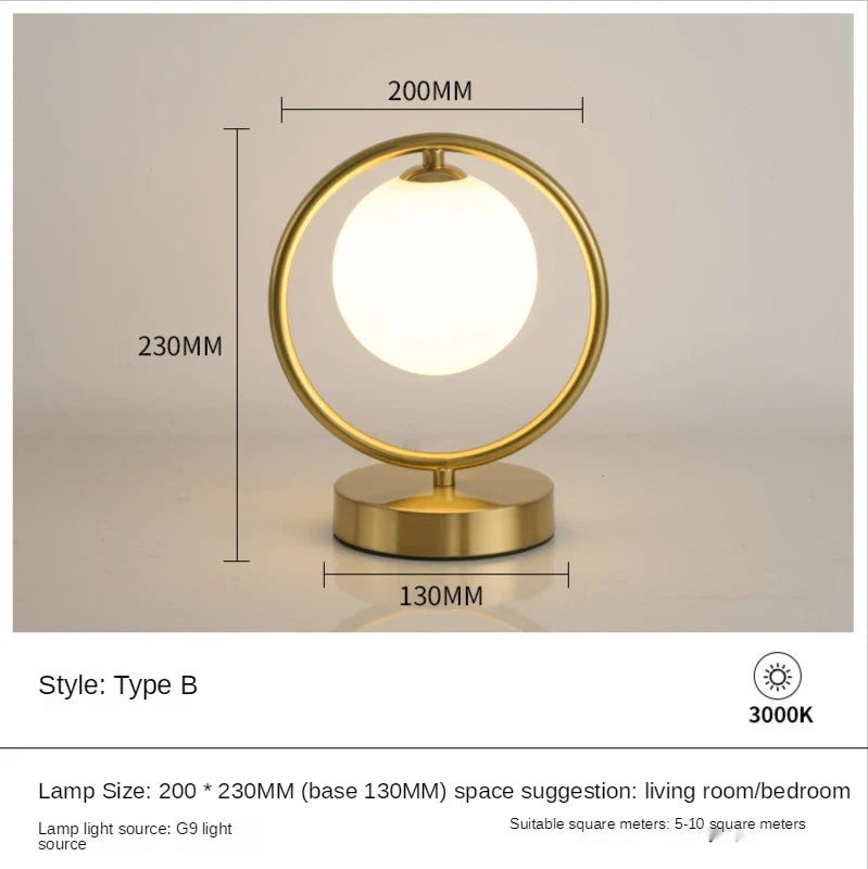 Lampe à poser dorée à led boule en verre