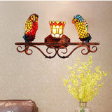 applique murale design en verre coloré motif perroquet