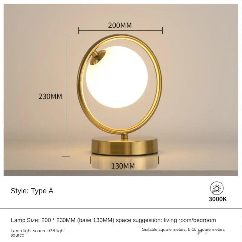 Lampe à poser dorée à led boule en verre