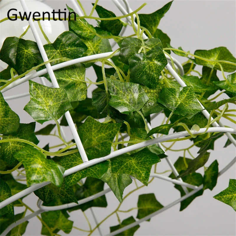 suspension moderne en cage à oiseaux avec plantes décoratives