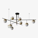 Lustre design avec branches et boules en verre et métal doré