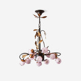 Lustre à branches fleuries en métal noir et verre rose — Lestage