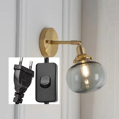 applique murale moderne avec chaîne de traction et boule de verre