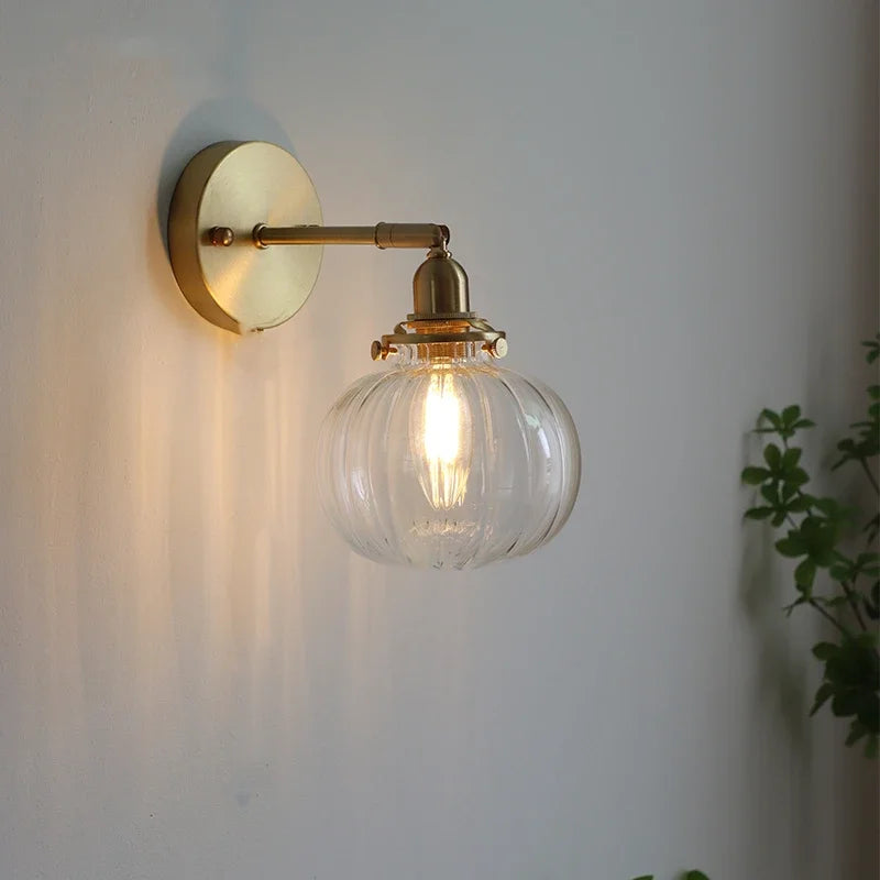 applique murale moderne avec chaîne de traction et boule de verre