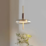 Suspension soucoupe en verre fumé et disque en laiton — Baume
