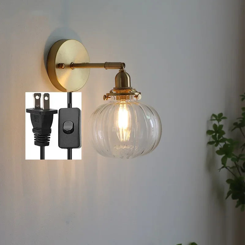 applique murale moderne avec chaîne de traction et boule de verre