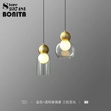 suspension en verre transparent avec tête en cuivre décorative