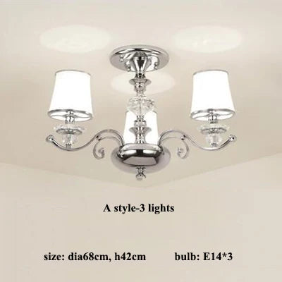 lustre chromé moderne à abat-jours blancs