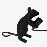 Lampe à poser en forme de souris tenant une lampe