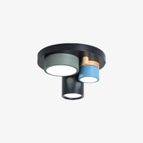 Plafonnier design avec plusieurs spots cylindriques colorés à LED
