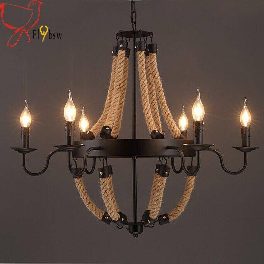 Lustre rustique en métal et cordages avec lampes en flamme