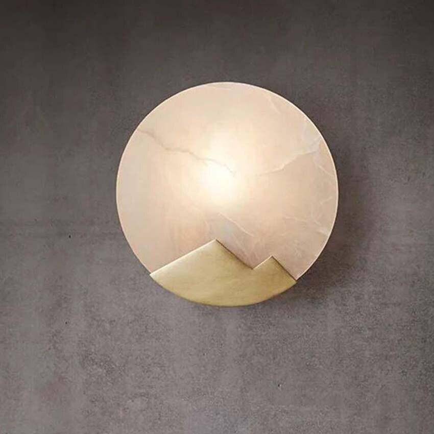 Applique murale design LED avec disque de marbre et métal doré