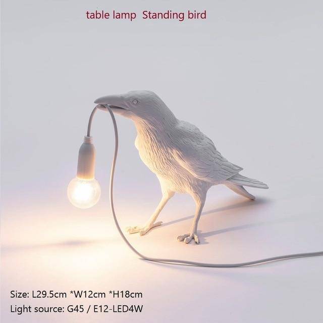 Applique murale LED avec oiseau qui tient une lampe dans son bec