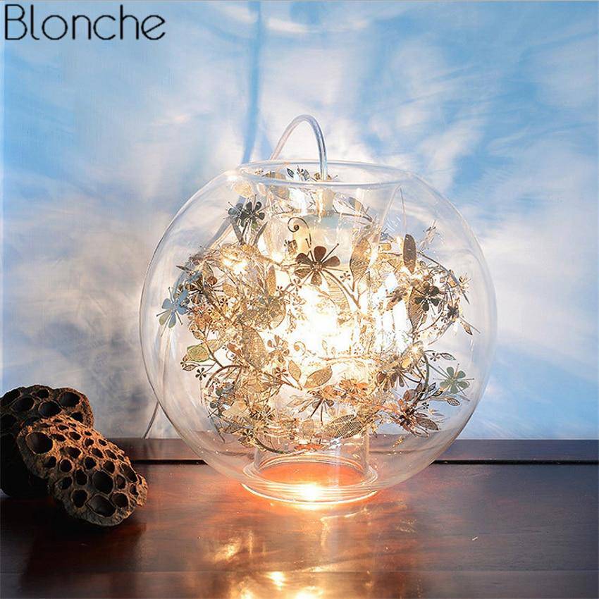 Lampe à poser boule en verre avec feuilles