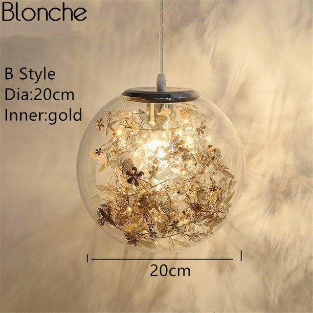 Lampe à poser boule en verre avec feuilles